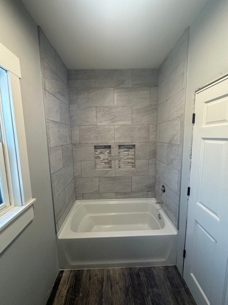 Tile tub surround with built in shower niches in Weyauwega, WI